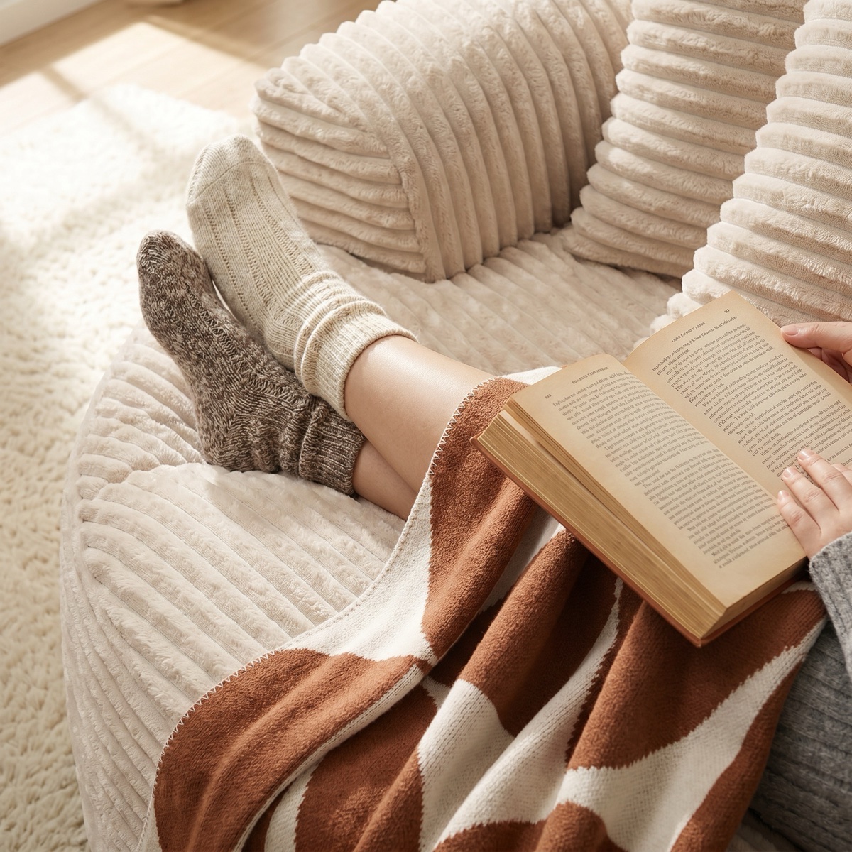 Person curled up reading in the round foam chair